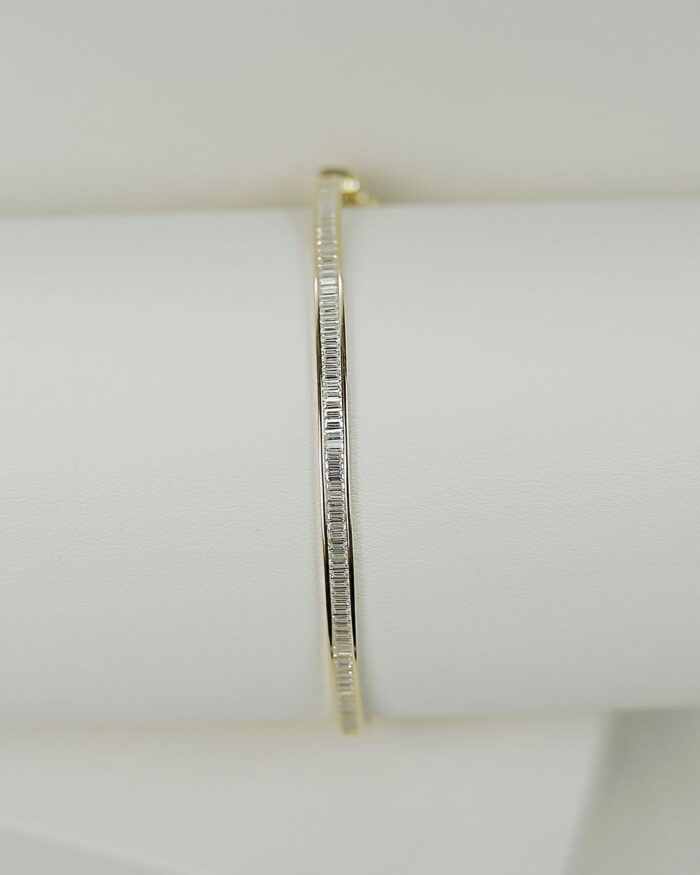 Diamanset Baguette Line Bracelet in yellow gold, a slim bangle channel-set with a continuous line of baguette diamonds