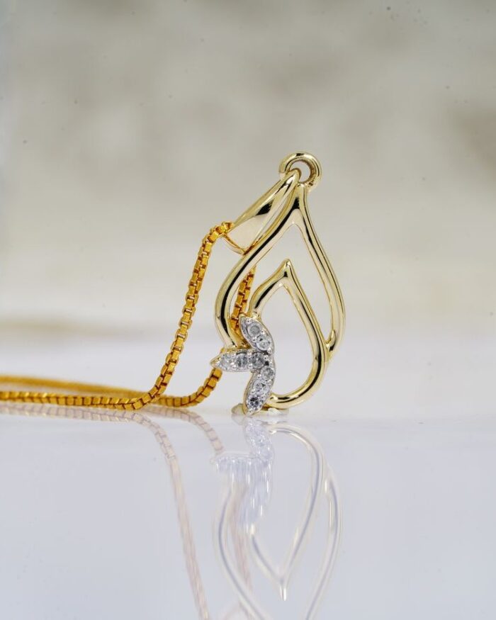 Diamanset Diamond Flame Pendant, 18k gold openwork flame pendant with pave diamond accent, white background