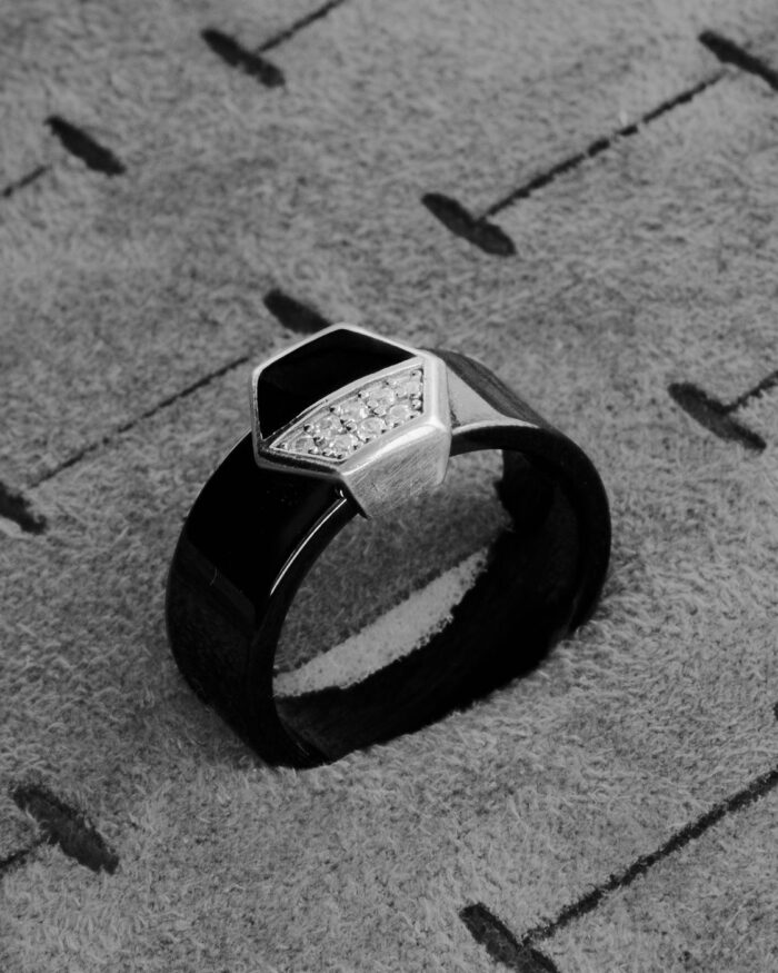 Diamanset Obsidian Hex Ring, a black band with an angular hexagonal face half-set with pavé diamonds