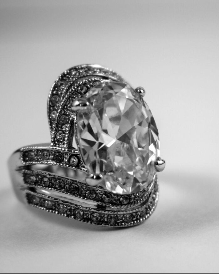 Diamanset Oval Solitaire Ring, an oval centre stone in a pavé-set split shank, on a white background
