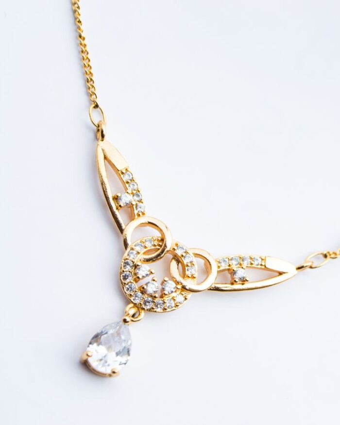 Diamanset Pear Drop Diamond Pendant, 18k gold necklace with pear-cut diamond drop, white background