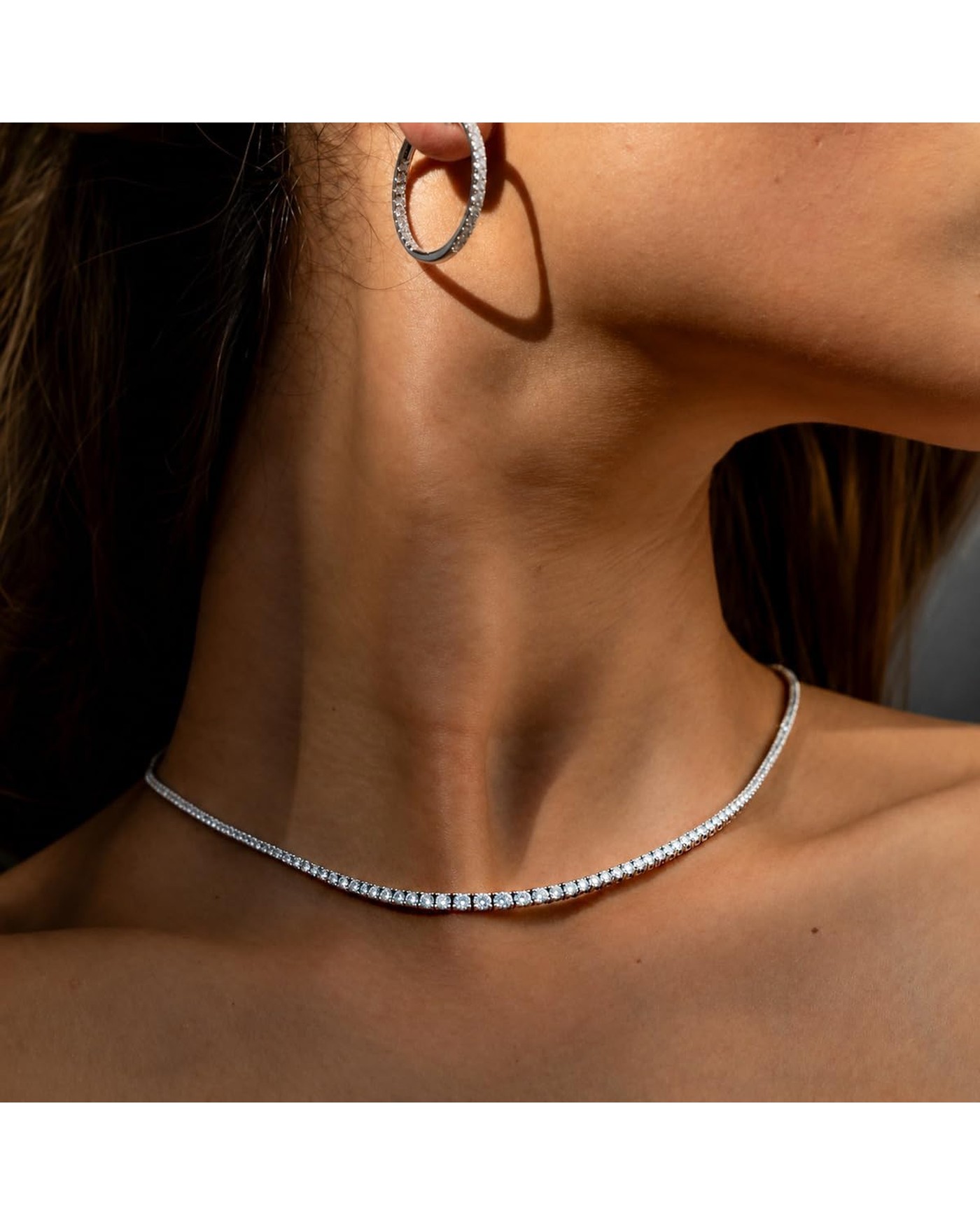 Diamanset Men's Moissanite Tennis Chain, silver tennis necklace with round 3 mm moissanite stones worn by a man