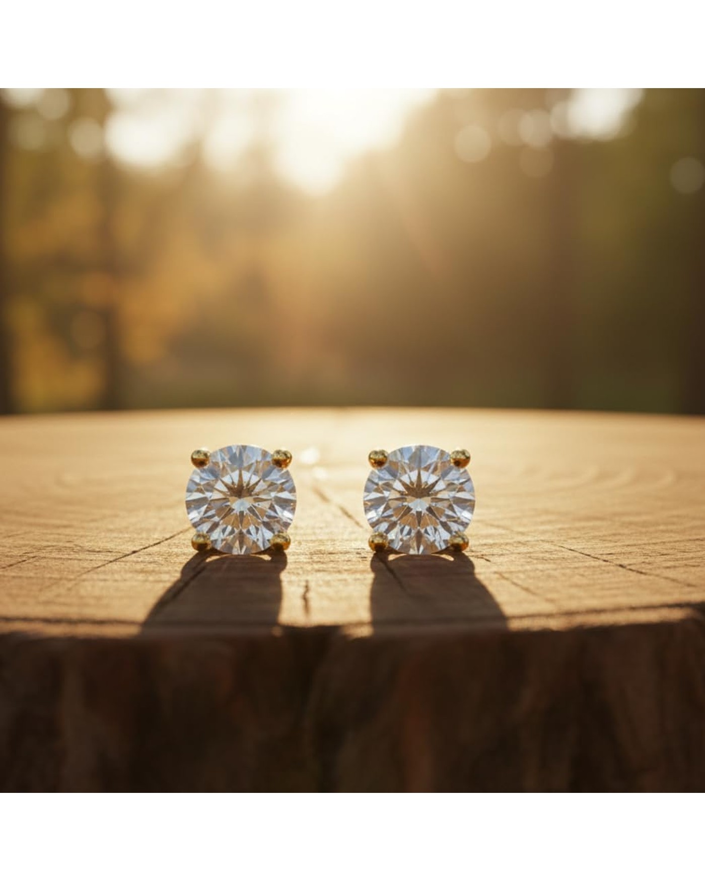 Diamanset Moissanite Solitaire Studs, gold plated prong earrings with a round 1 ct moissanite each